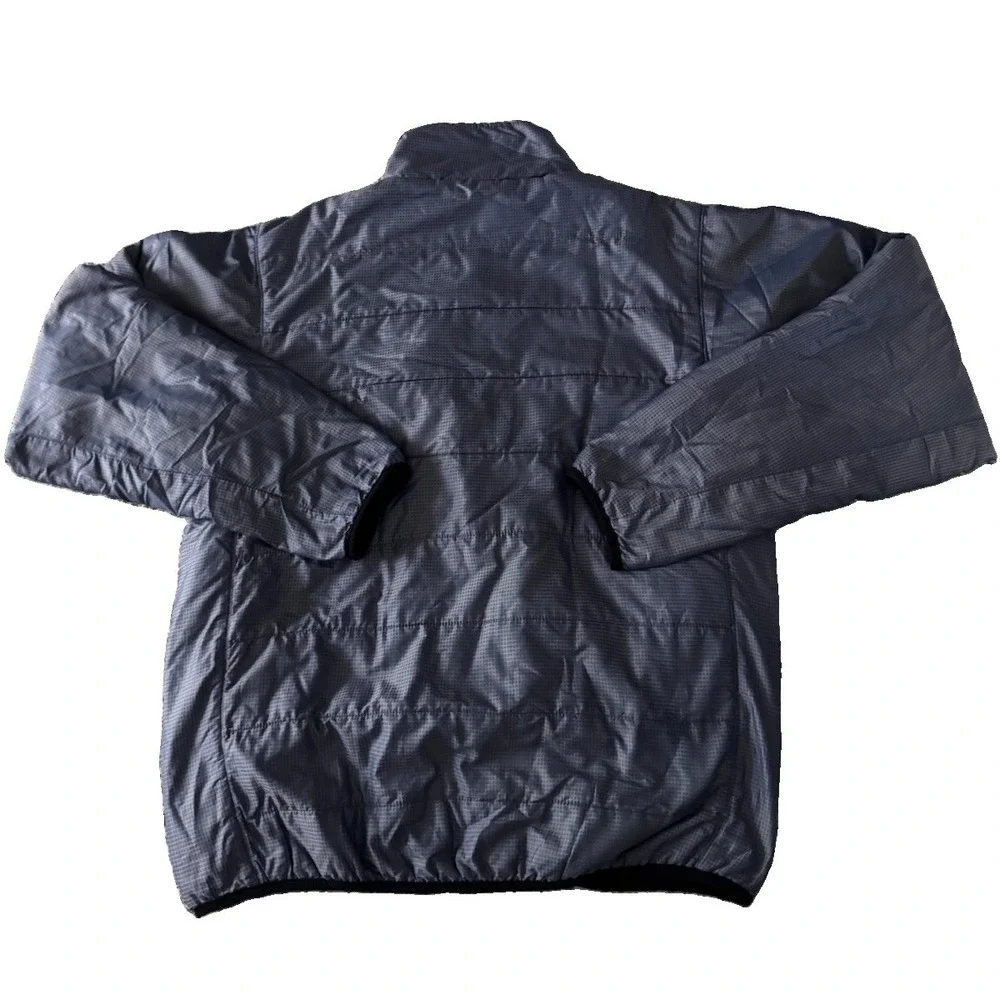 The North Face Mens Medium Blue Plaid Jacket With Built In Stow Away Bag Pocket